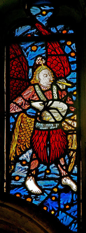 Window s1 depicting a musician angel with pipe and tabor (stained glass)