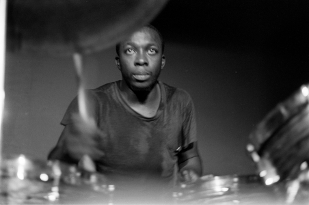 Black and white photo of Gordon Mfandu playing the drums at a jazz band performance at…, 1966 (photo)