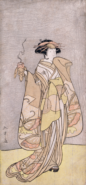 A full-length portrait of the actor Ichikawa Monnosuke II in a female role holding an incense burner (colour woodblock print)