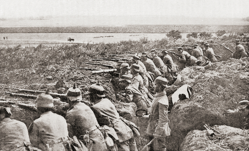 Entrenched German soldiers await the arrival of the Belgians during World War One, from The History of the Great War, pub.c. 1919