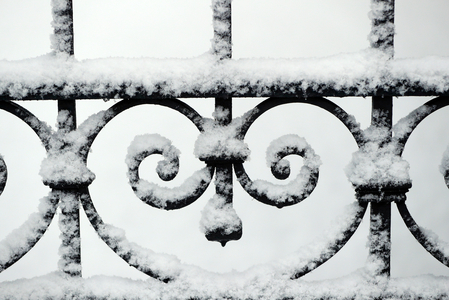 Close-up of metal gate with snow, Saint-Gervais, France (photo)