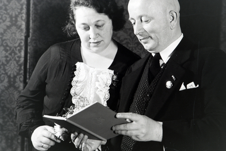 The parents of an extended family at the concession oh the Honour Cross, Germany 1930s (b/w photo)