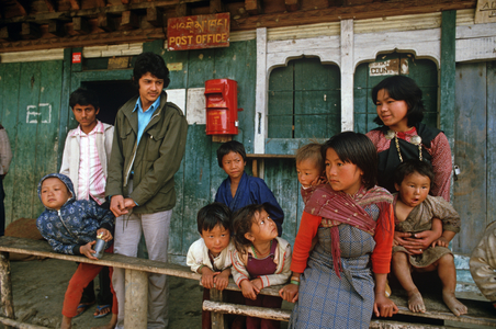 Bhutanese in front of Geddu village Post Office, Bhutan, Himalayas (photo)