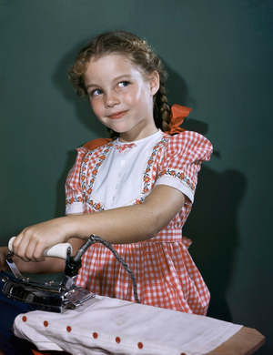 Close-up of a girl ironing clothes