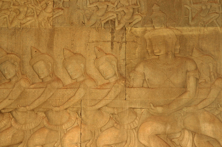 Churning of the Ocean of Milk carving, gods with crested helmets, Budhhist-Hindu Temple, Angkor Wat, Siem Reap, Cambodia