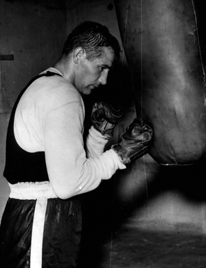 Apr. 21, 1954 - Mitri Trains For Turpin Fight: Photo Shows Tiberio Mitri, the Italian champion, seen at punxh bag, during his training art Santamarinella, near Rome, in preparation for his fight agganist Randolph Turpin in Rome on May 2. Turpin's European middleweight title will be at stake