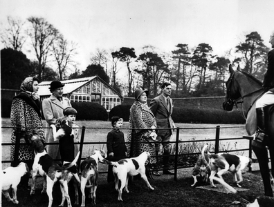 Jan. 01, 1955 - Royal Children At Hunt Meet.: The Queen, Queen Elizabeth the Queen Mother, Prince Charles, Princess Anne and the Princess Royal (next to the Queen), talking to the Master (Major Robert Hoare) when they attended a meet of the West Norfolk Foxhoubds at Harpley Dams, the residence of Major and Mrs. O. O'F Wilson, yesterday. Major Wilson stands beside the Queen Mother