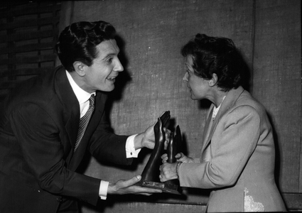 May 15, 1956 - Edith Piaf Helping Gilbert Becaud Carry his Trophies