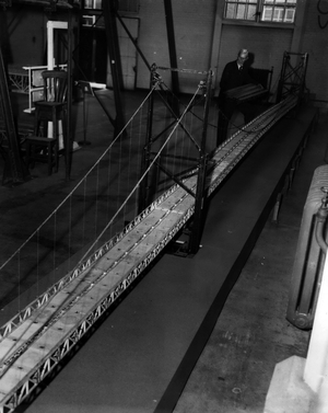 Dec. 12, 1953 - Giant Bridge over the Severn: The biggest bridge in Europe the third biggest in the world is to be built across the River Severn as part of the New Government plan to modernise British road services. It will cost between £12,000,000 and £20,000,000. The bride was first suggested 20 years ago. It will connect Bristol and Cardiff and bring all the South West country into direct touch with the Midlands, saving scores of thousands of miles a day in road transport. It will link the main road from Gloucester to Bristol with the Gloucester South Wales road. Plans for the Severn Bridge were laid years ago, and full tests have been made during the past few years on models at the National Physical Laboratory at Teddington, Middlesex