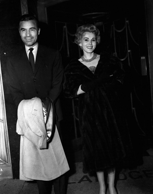 Apr. 29, 1954 - Zsa Zsa Gabor and” Rubi” in London.: Zsa Zsa Gabor, the film actress, arrived at Croydon yesterday from Paris, in a place piloted by Porfirio Rubirosa, who married and parted from Woolworth heiress Barbara Hutton last month