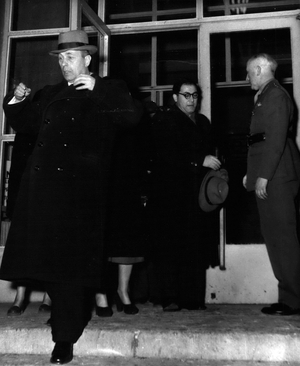 Jan. 07, 1954 - After a six hour conference with his Western colleagues Soviet High Commissioner Dengin left the British headquarters. He didn't look exactly friendly. The discussion was postponed and will continue in the Soviet headquarters. Pictured: The Soviet representative Dengin (left). Far right is British commander Coleman