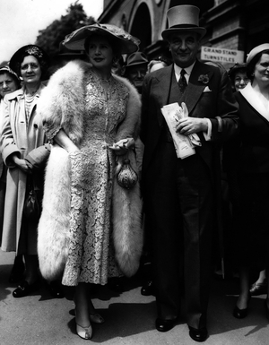 Jun 06, 1954 - First day of the Royal Ascot meeting... Sir Bernard and Lady Docker arrives: Photo Shows Lady Docker wears a red straw hat when - with Sir Bernard Docker she arrived at Ascot today for the first day of the Royal meeting