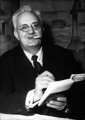 Tue. 03, 1954 -” Six years of comedie Francaise” brings reward to author: M. Pierre-Aime Touchard, former administrator of the comedie fraisa ~ autographs his book entitled” Six years of the comedie francaise: He was awarded the Prix De L'Odeon for this book