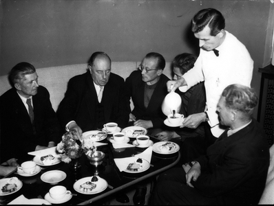 Oct. 27, 1954 - After a year of deprivation and austerity: Coffee and Cake. After a one year break German prisoners of war unexpectedly arrived in Berlin and West Germany from Soviet Russia. There was a release-transportation of 62 prisoners-of-war, of which half went to West Germany and Berlin. Berlin's ruling mayor, Dr. Walther Schreiber (second from left), insisted on an hour of coffee with the prisoners in the Sch? neberg town hall