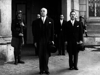 Oct. 10, 1954 - Mr Jean Chauvel: The newly appointed ambassador of the French Republic in Austria presented his credentials to Federal President Theodor Koerner in a ceremony which took place at the President's official residence located in the former Imperial Palace of Vienna. Picture shows: Ambassador and High Commissioner Jean Chauvel escorted by Legation secretary Dr. Korob leaving the federal president's official residence after the ceremony took place