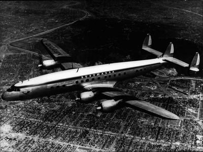 Apr. 04, 1954 - The German “” Lufthansa”” soon flies again - The German “” Lufthansa”” will open its trans-Atlantic services in the next year with this four motors “” Super-Constellation””. The Luftag Cologne which prepares now the reburn of the “” Lufthansa”” ordered four these largest and greatest aeroplanes at the Lockheed in Burbank (California). 80 passengers will find places in this comfortable aeroplane. Every aeroplane will cost 7.1 million of German marks. This is the first picture of the aeroplane with the original inscription