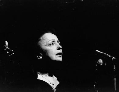 Portrait of French singer Edith Piaf at a concert