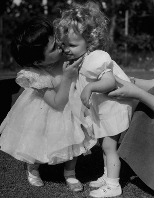 Jun 06, 1954 - Birthday Party For Googie's Daughter. Picture taken at the fourth birthday party of Joanna? daughter of Mr. John McCallum and Miss Googie Withers, shows 4-year-old Joanna greeting 18-months guest Vanessa Clewes when she arrived for the party