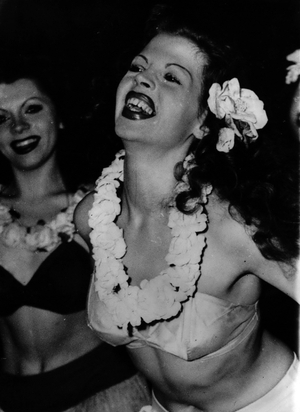 Dec. 19, 1953 - 19-12-53 They call her the “” German Rita””. Lovely dancer in Munich - Looking very much like the “” Dancing Goddess”” is German dancer Hannelore Diez, who they claim is a double of Rita Hayworth. Hannelore is the star of the Cabaret “” Metro Girls”” which appear every night at the Bongo Bar in Munich