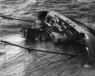 Nov. 11, 1954 - Eight trapped in wrecked Lightship. Man Stands on side of vessel.: Eight men are reported to be trapped in the hull of South Goodwin Lightship wrecked on the Goodwin Sands. One member of the crew was seen standing on the side of the hull - and he was hoisted to safety by a helicopter which flew to the scene. He said the remainder of the crew are trapped belowand the Trinity House vessel Vestral is dashing to the spot with oxy-acetykubg apparatus aboard