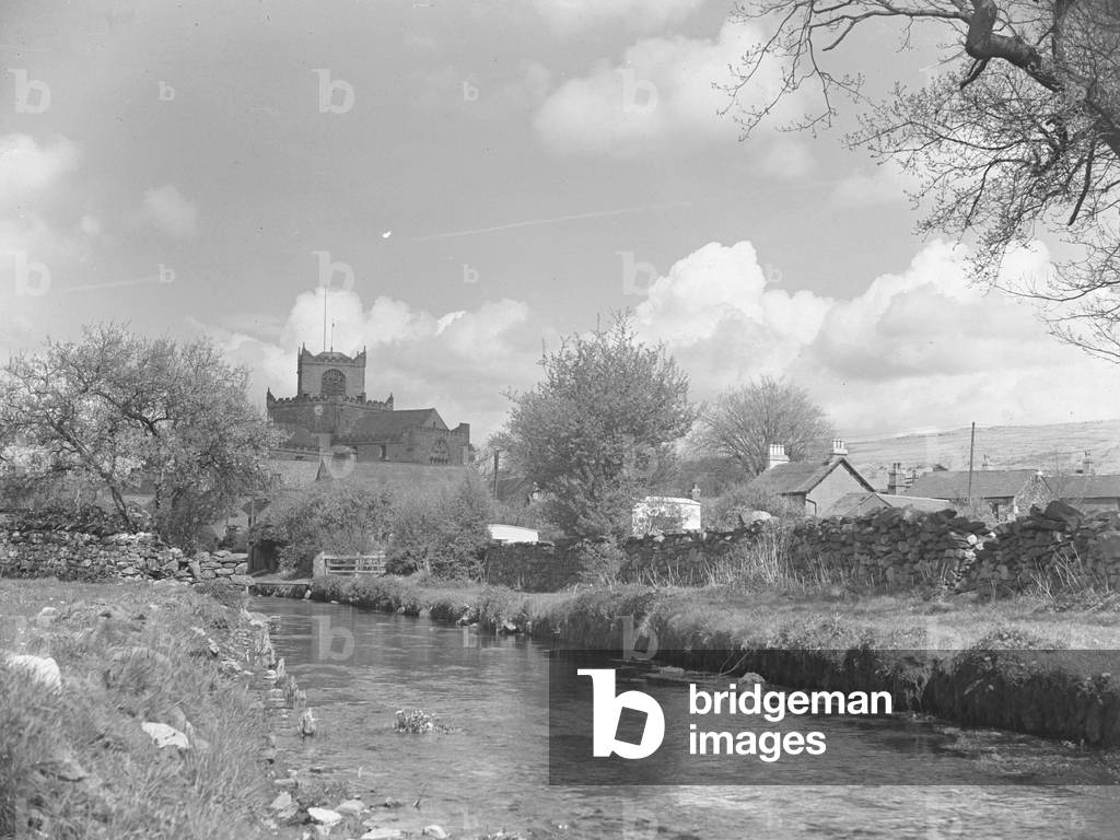 View down river at Cartmel with Priory in view, 1930s-60s (b/w photo)