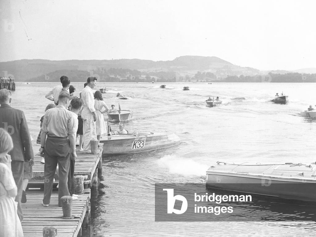 Powerboats arriving at jetty after race, 1930s-60s (b/w photo)