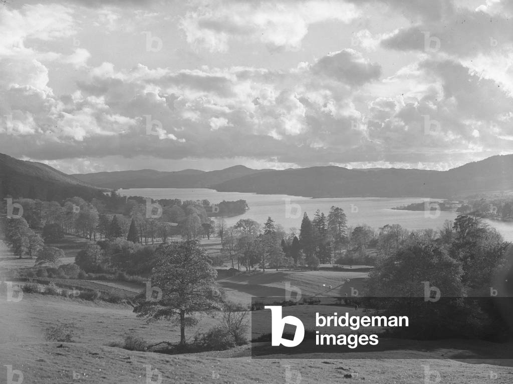 Looking down Coniston Water with fields and trees in foreground, 1930s-60s (b/w photo)