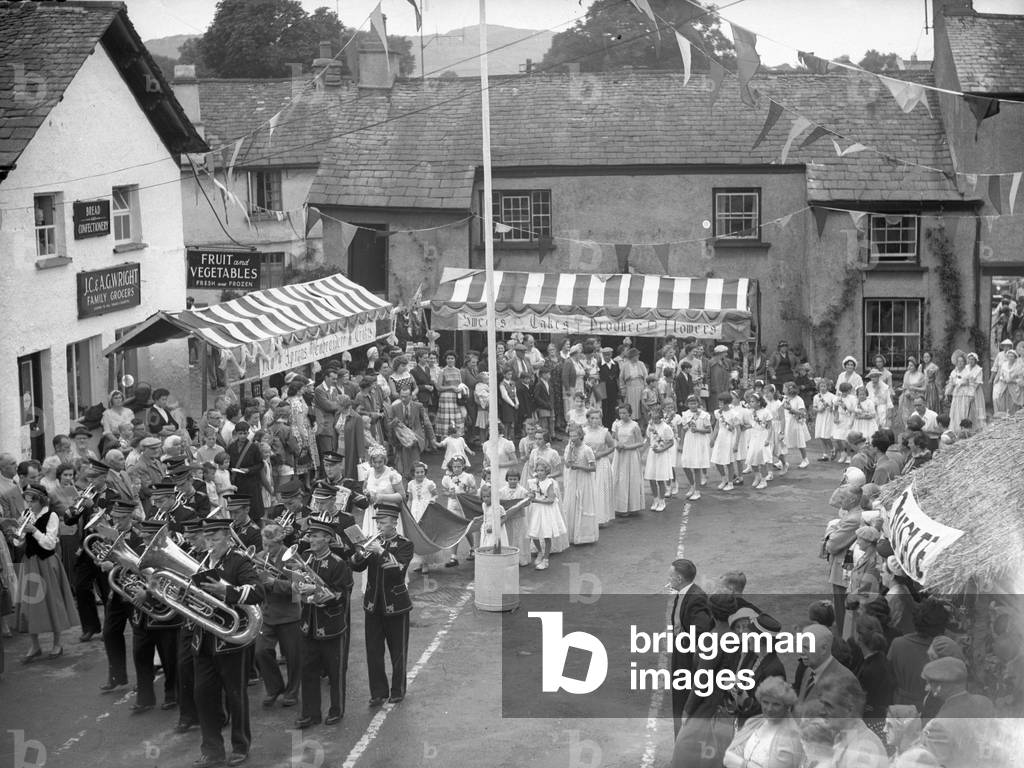 May Day procession at Hawkshead led by brass band, 1930s-60s (b/w photo)