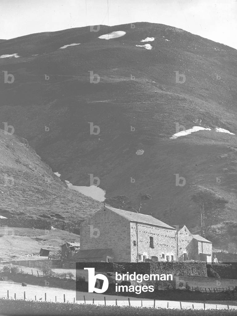 Barn below Black Cumb near Barrow covered in patches of snow, 1930s-60s (b/w photo)