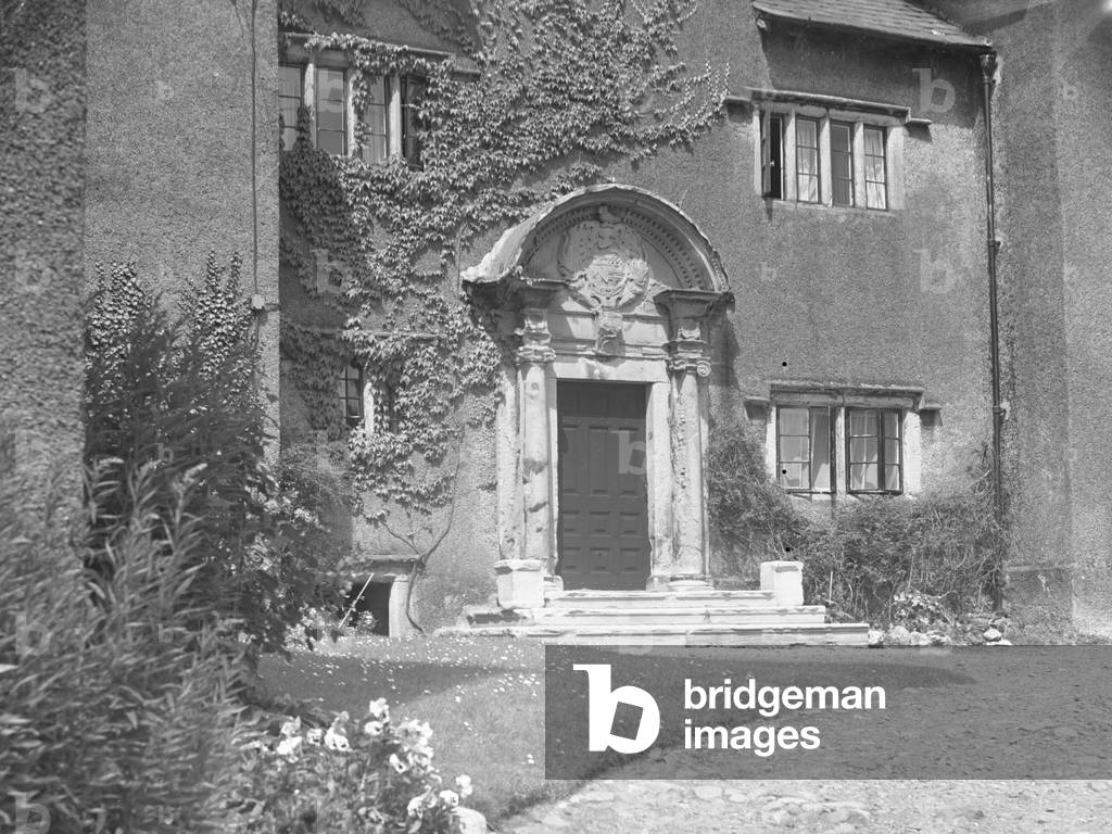 Front door to Cark Hall with coat of arms above door, 1930s-60s (b/w photo)