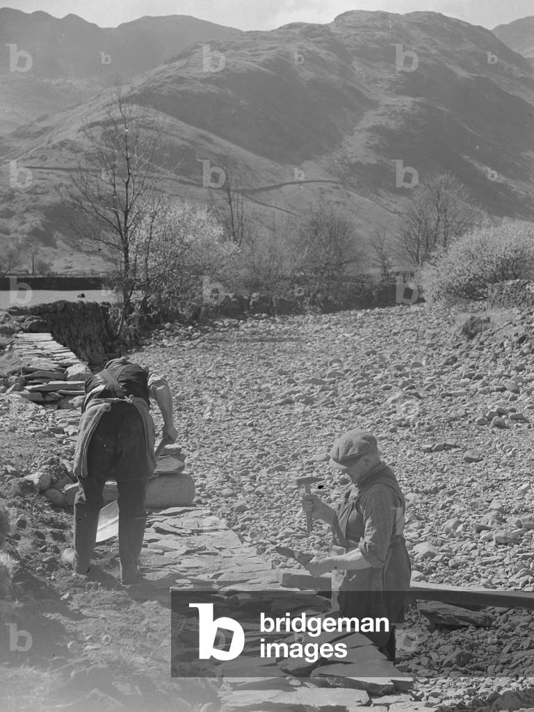 Wallers working on footings of dry stone wall, 1930s-60s (b/w photo)
