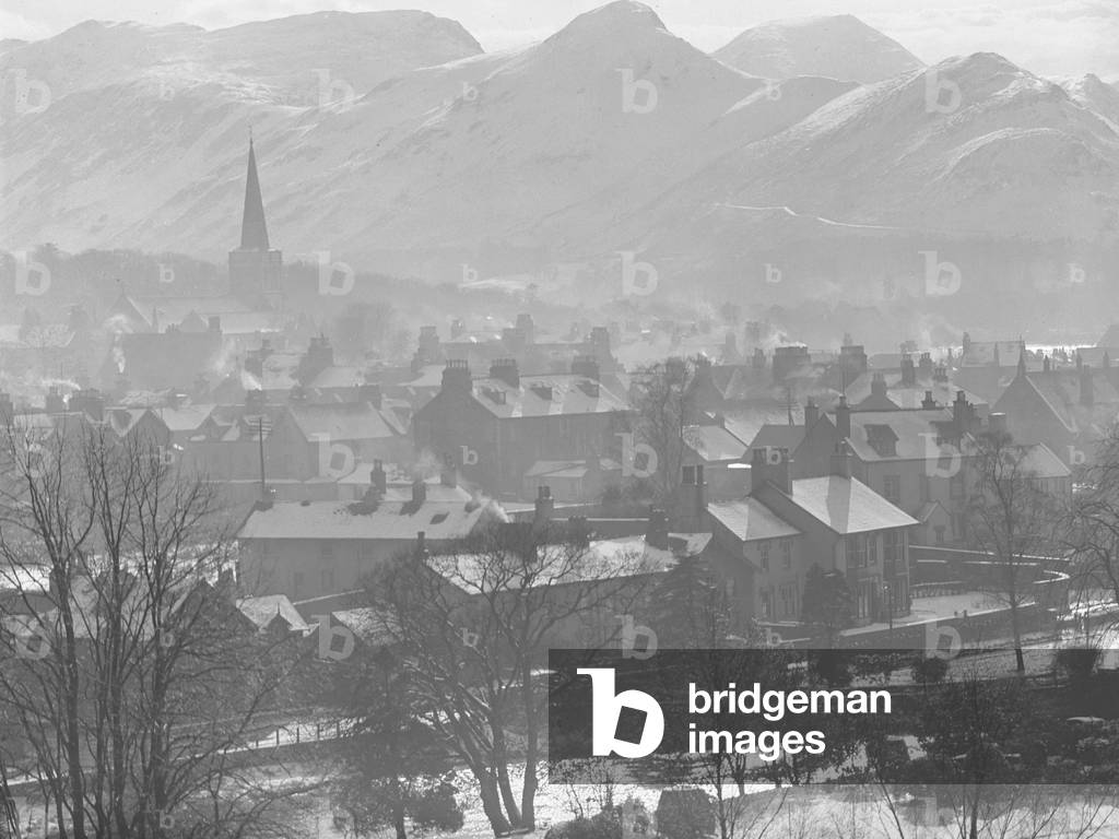 View of Keswick from up high with smoking chimneys and light dusting of snow, 1930s-60s (b/w photo)