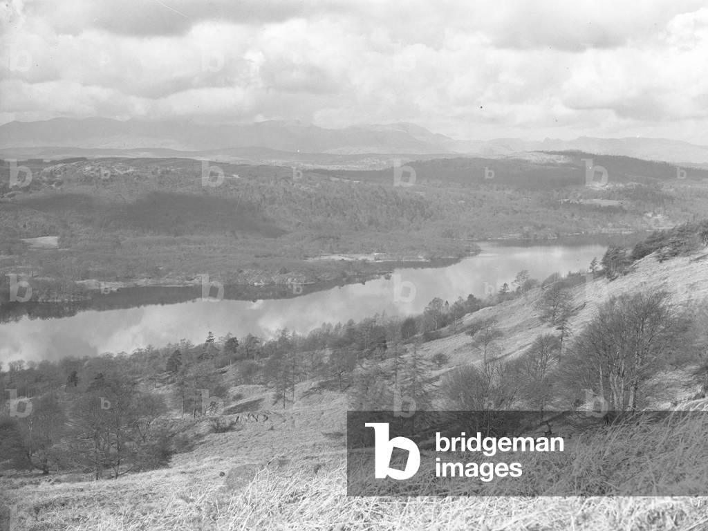 View across a lake, woodland and hills at Furness Fell, 1930s-60s (b/w photo)