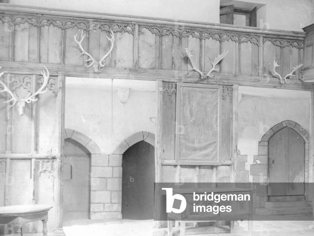 A view of the dining room at Haddon Hall, including furniture, and deer antlers on the walls, 1930s-60s (b/w photo)