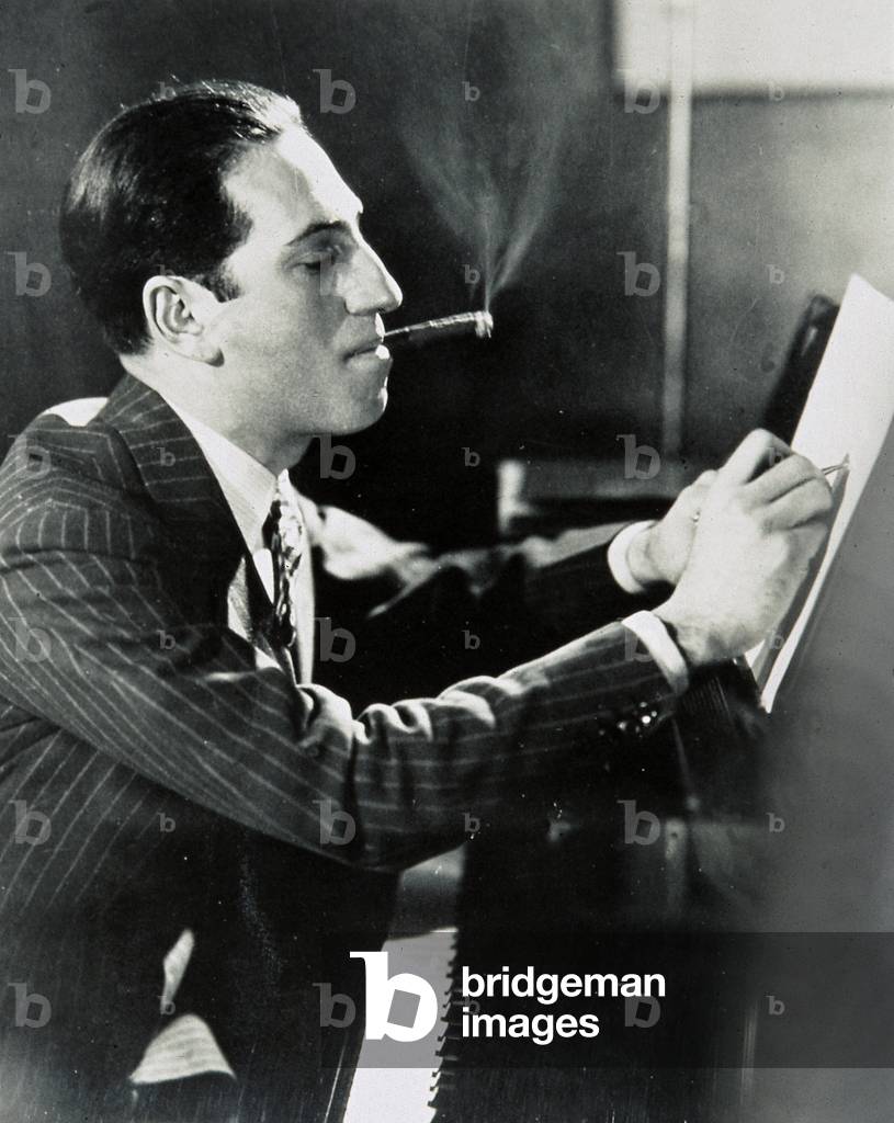 Image of Photography depicting Portrait of composer George Gershwin (1898-1937) on the piano 1920 by Unknown p