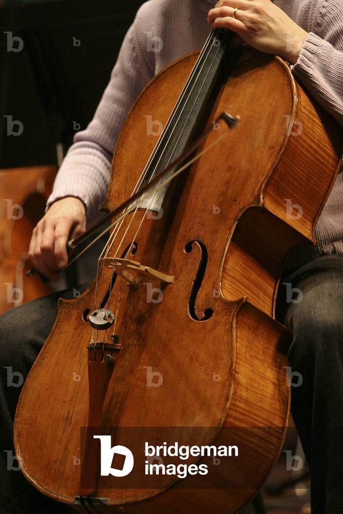 Cello - cello being played with a bow.