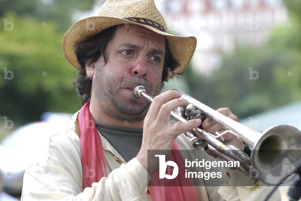 Frank London playing the trumpet. American trumpeter, bandleader, and composer at London Klezmer Festival in Regent's Park, 13 August 2006, London, UK.