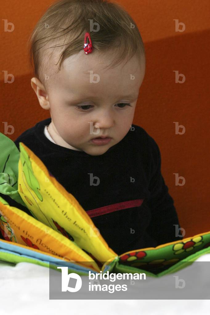 Baby reading a cloth