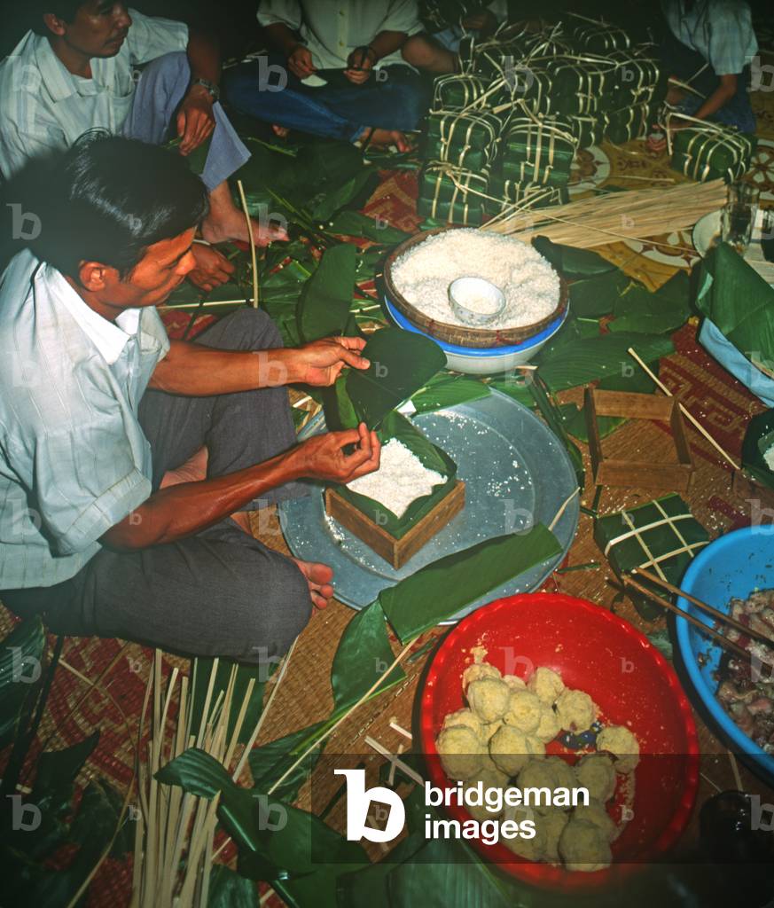 Family Making Banh Chung, Tet New Year, Saigon, Vietnam (photo)