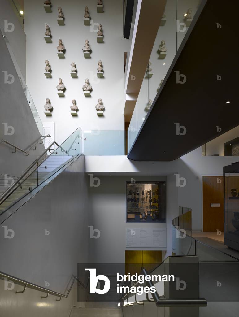 Interior staircase and wall with display of stone portrait busts, Ashmolean Museum and Extension, Oxford, UK (photo)