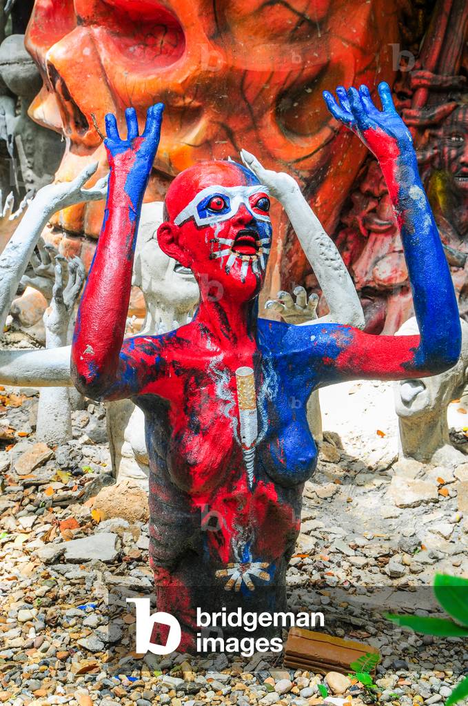 Smoker, Buddhist garden of Hell, Wat Mae Kaet Noi, near Chiang Mai, Thailand (photo)