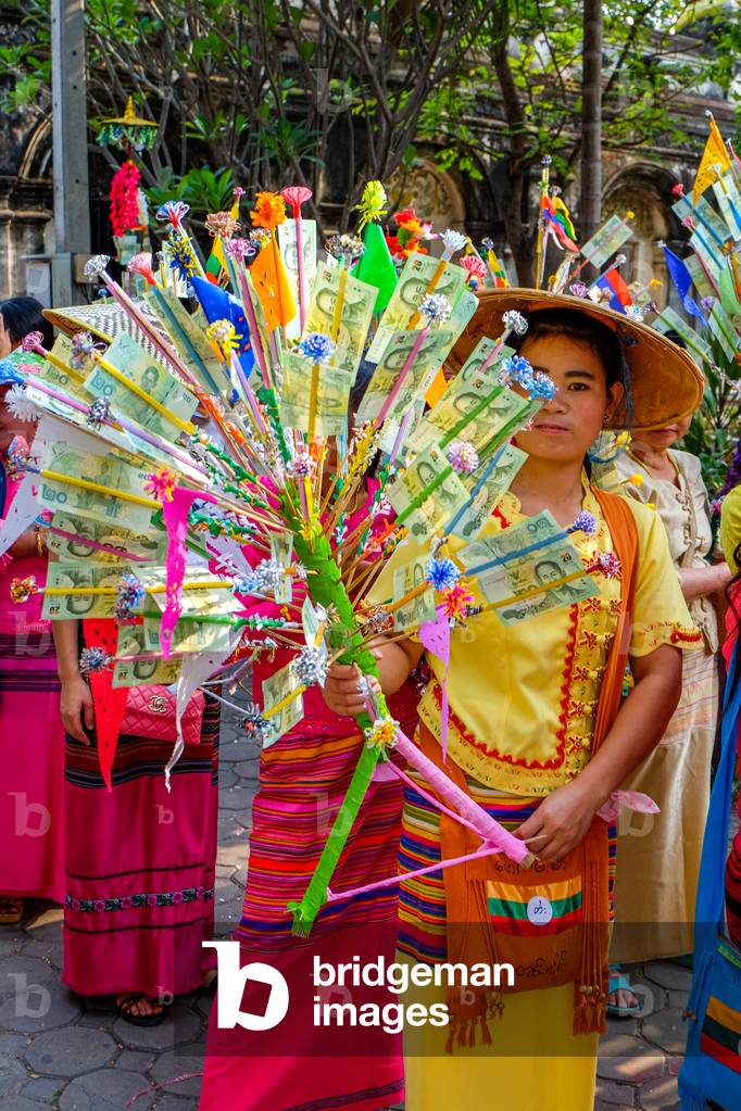 Carrying money tree in the Poy Sang Long (Shan ordination ceremony for boys aged 7-14) parade; Wat Pa Pao, Chiang Mai, Thailand. 