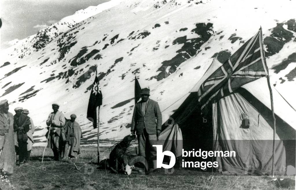 Tent in snowy mountain pass, Chinese & British flags fly, 1944 (b/w photo)