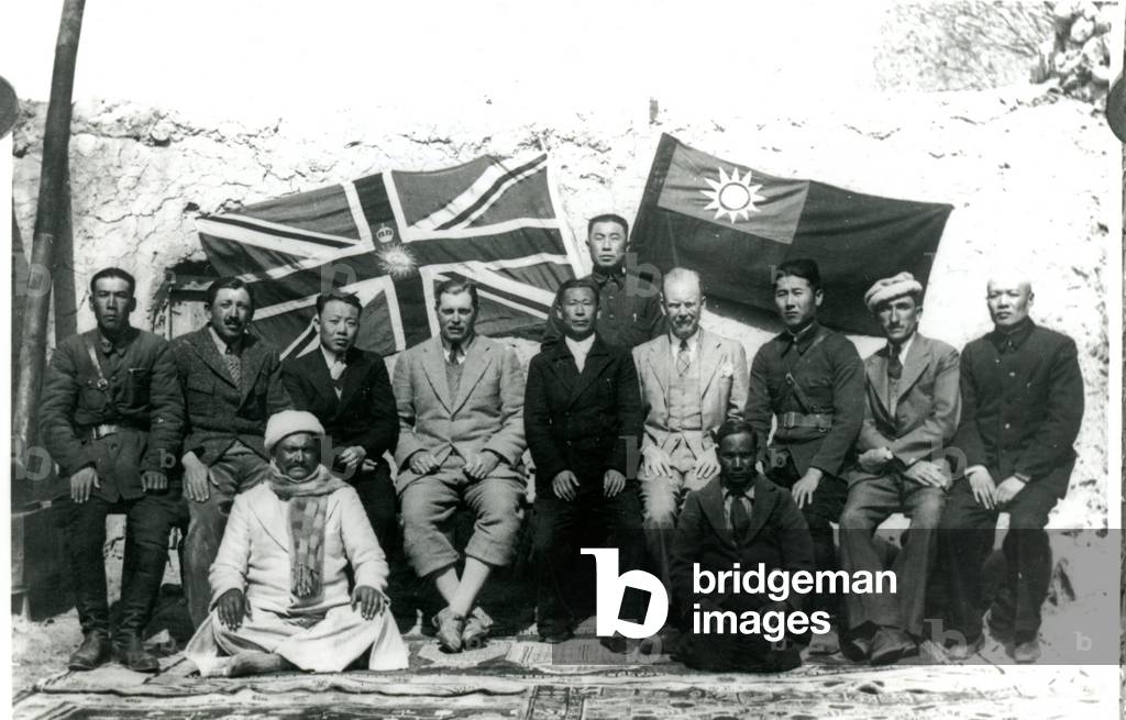Seated group with flags, c.1944 (b/w photo)