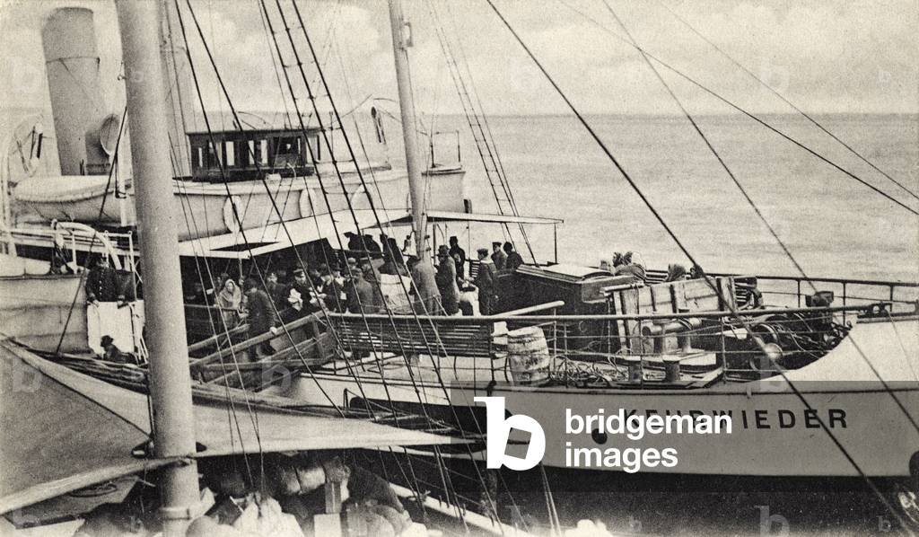 Jewish immigrants - passengers  on top deck of ocean liner Hamburg America line (HAPAG) leaving Europe (Russia) and bound for America and elsewhere