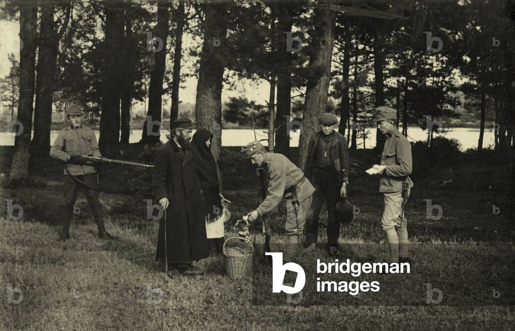 German soldiers searching basket of Jewish couple and man  during German occupation of Galicia in Eastern Europe in World War I