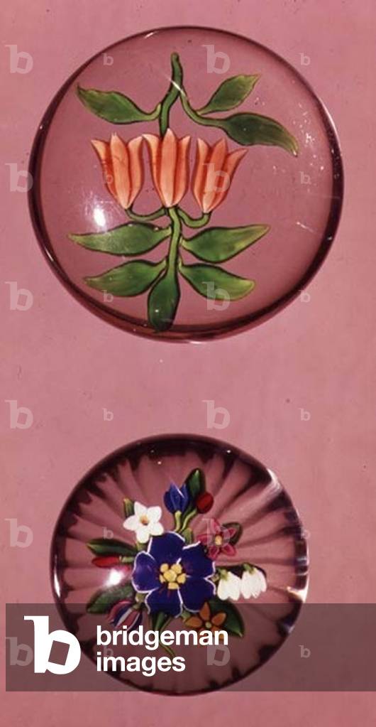 Two glass paperweights, one Baccarat bouquet with star-cut base, one Baccarat crown imperial on a clear ground,mid 19th century