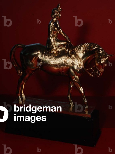 Equestrian statuette of H.M. Queen Elizabeth in the uniform of C in C of the Grenadier Guards, mounted on 'Winston', presented by Sir Leslie Boyce, made by the London Assay Office, 1952 (silver-gilt)