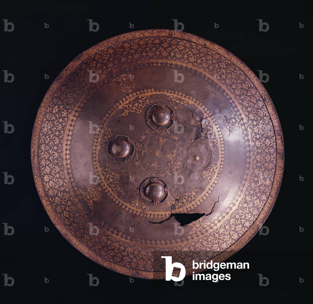 Steel shield with intricate gold decoration