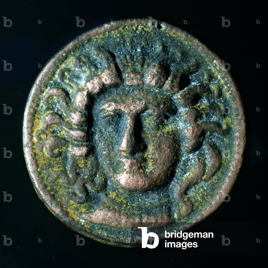 Modern forgery of coin (not Roman) depicting a facing female head (bronze)